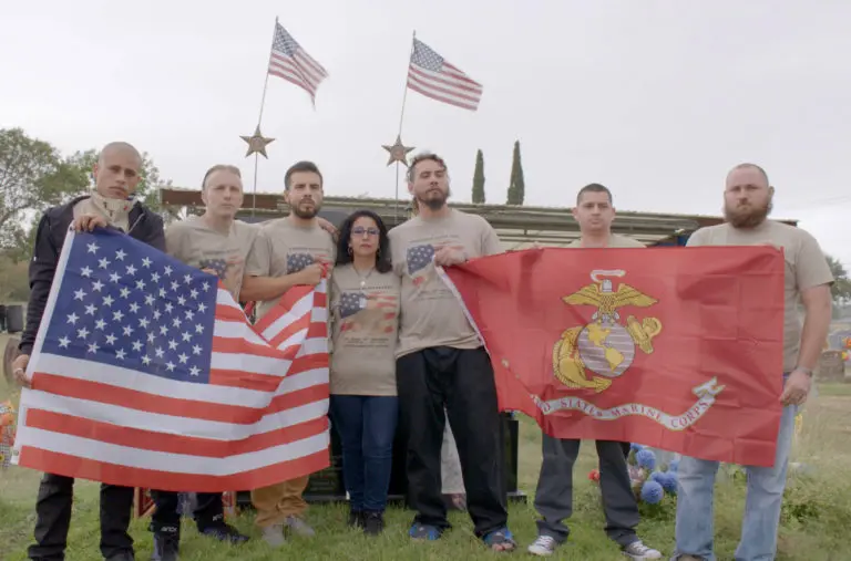Image of Yolanda Villarreal with Marine brothers at memorial for JV Villarreal.